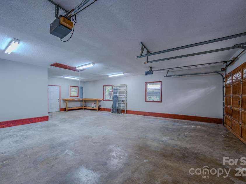 35 Byrd Road, Candler, NC 28715.  MLS# CAR4314143, YatesRealty ID 743. Large attached garage with work bench