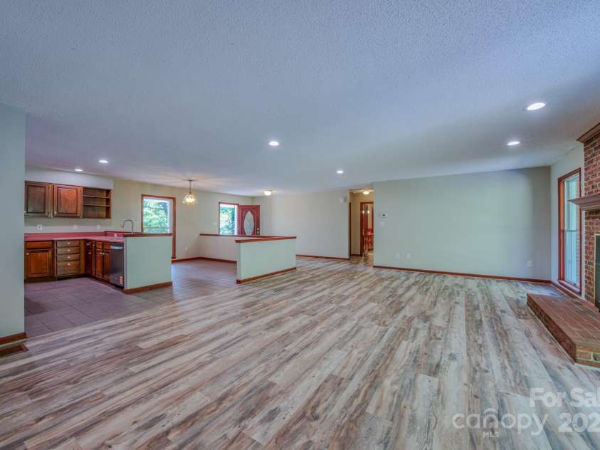35 Byrd Road, Candler, NC 28715.  MLS# CAR4314143, YatesRealty ID 743. Large open floor plan.  Living area, dining area, kitchen, Gas logs in fireplace