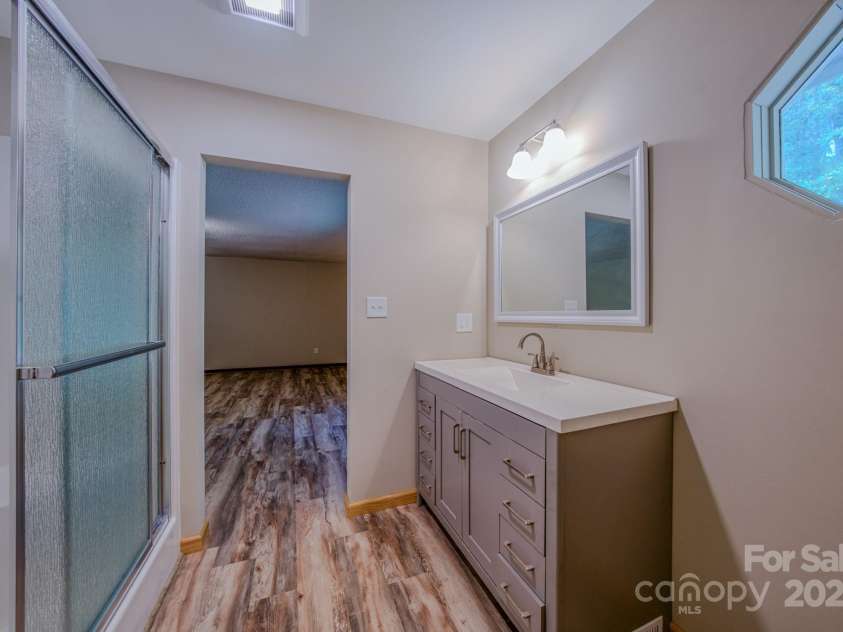 35 Byrd Road, Candler, NC 28715.  MLS# CAR4314143, YatesRealty ID 743. Primary en suite bath 