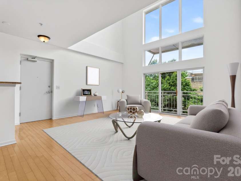649 Raphael Place, Charlotte, NC 28205.  MLS# CAR4392516, YatesRealty ID 7431. Gigantic Loft style windows flood the space with natural light, virtually staged