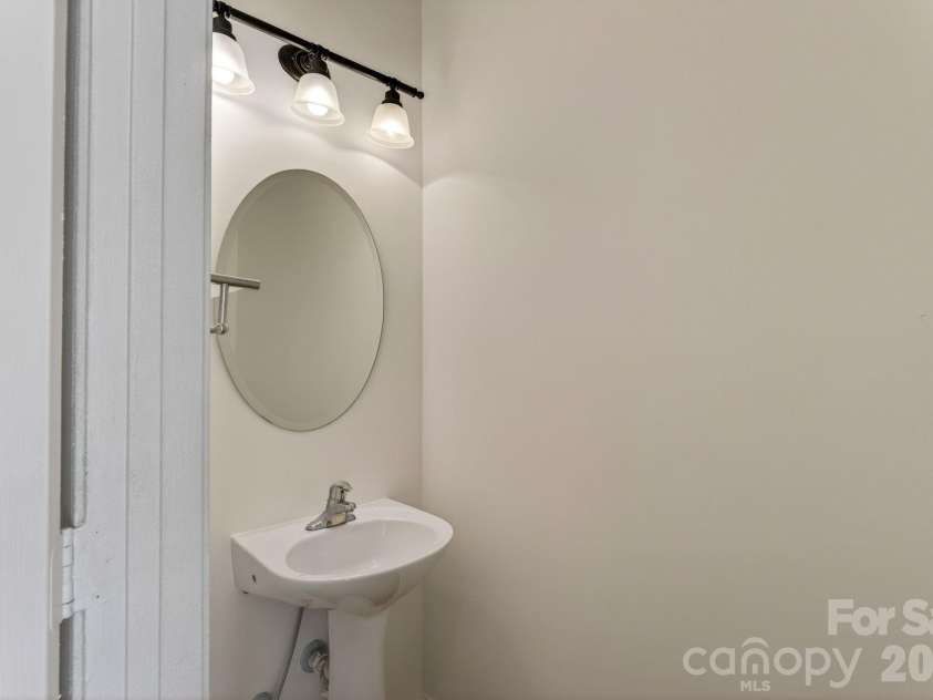649 Raphael Place, Charlotte, NC 28205.  MLS# CAR4392516, YatesRealty ID 7431. Half bath off hall downstaits