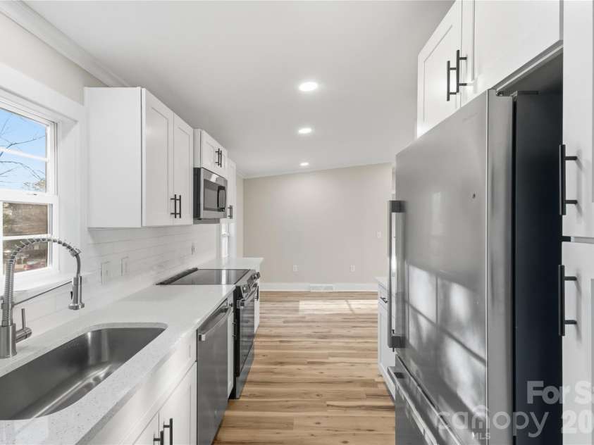 3313 Weeping Willow Drive, Concord, NC 28027.  MLS# CAR4349604, YatesRealty ID 7432. Kitchen view from mudroom