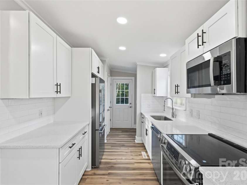 3313 Weeping Willow Drive, Concord, NC 28027.  MLS# CAR4349604, YatesRealty ID 7432. Kitchen view into mudroom