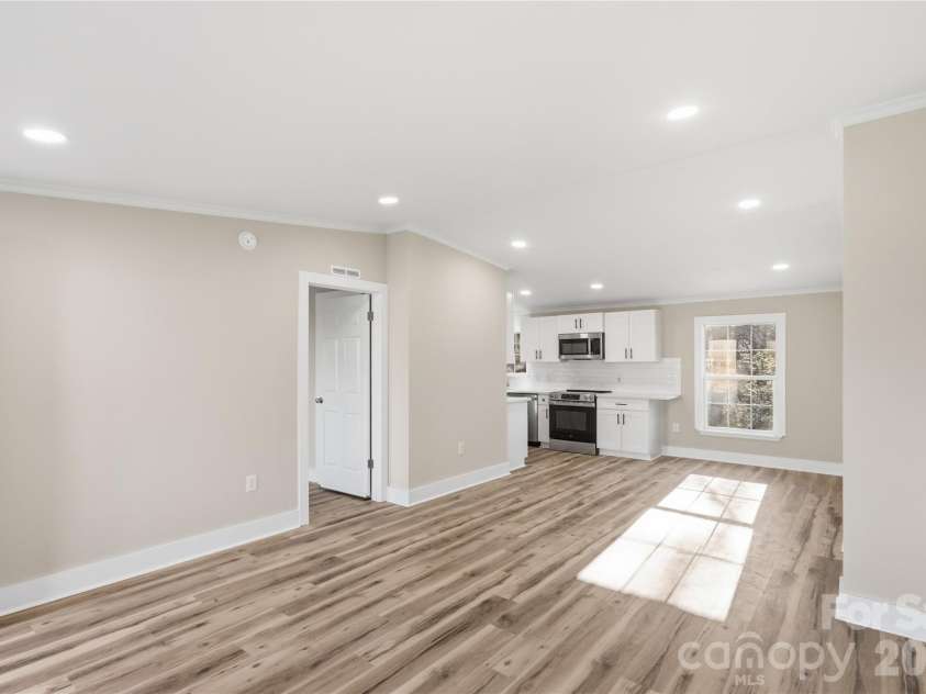 3313 Weeping Willow Drive, Concord, NC 28027.  MLS# CAR4349604, YatesRealty ID 7432. Living room view into kitchen