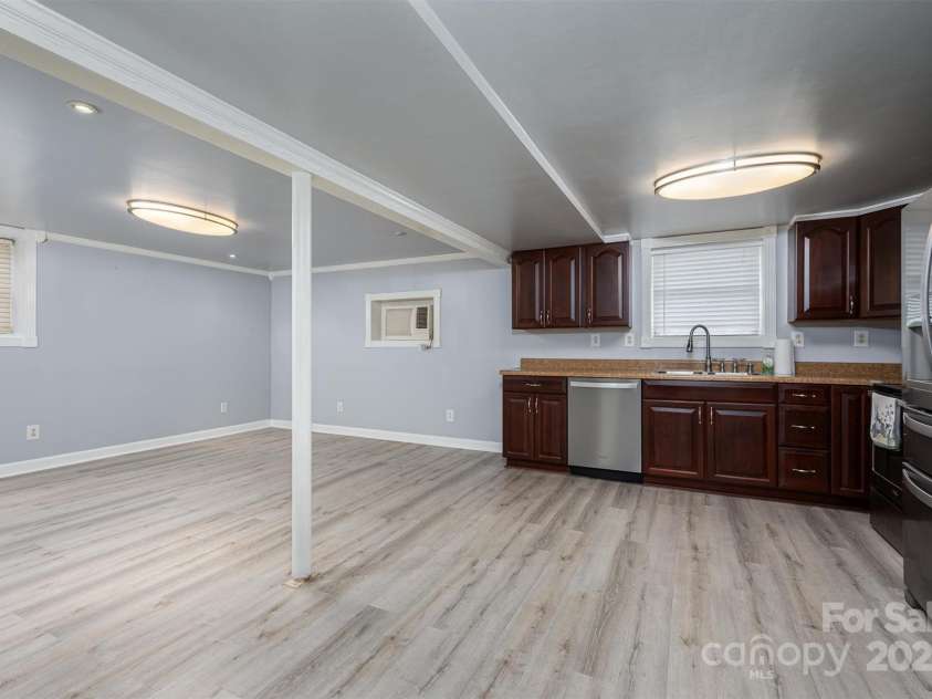 1501 Fern Forest Drive, Gastonia, NC 28054.  MLS# CAR4222511, YatesRealty ID 7440. Downstairs kitchen and family room