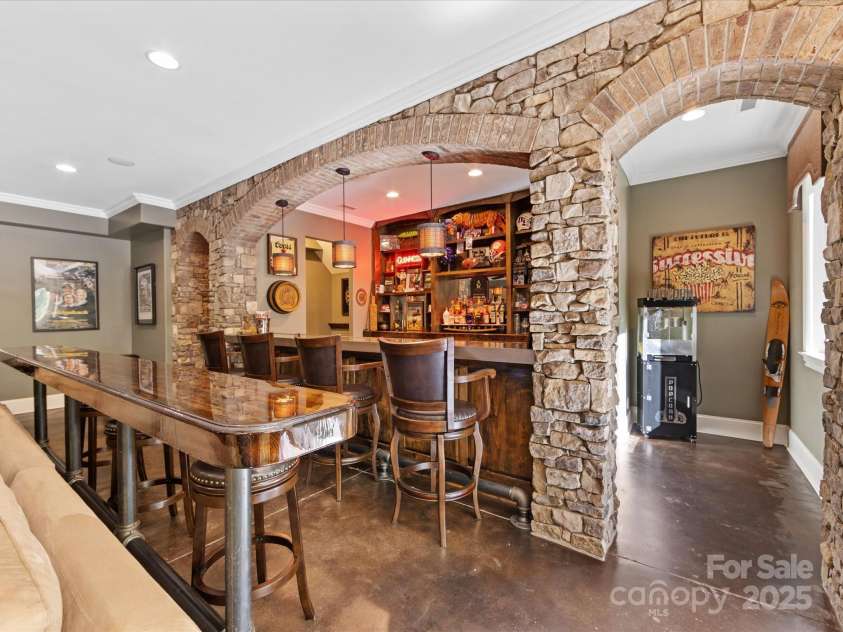 1012 Shippon Lane, Waxhaw, NC 28173.  MLS# CAR4244187, YatesRealty ID 7442. This bar is incredible!  Be sure to check out the bartender amenities, including SubZero pullout fridge/freezer drawers