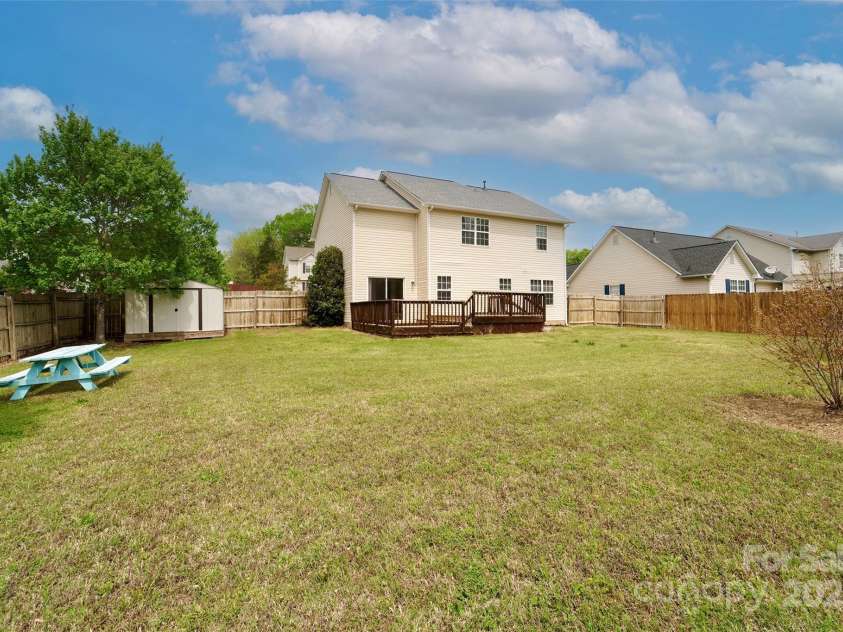 225 Carrie Court, Concord, NC 28027.  MLS# CAR4245716, YatesRealty ID 7444. Big backyard!