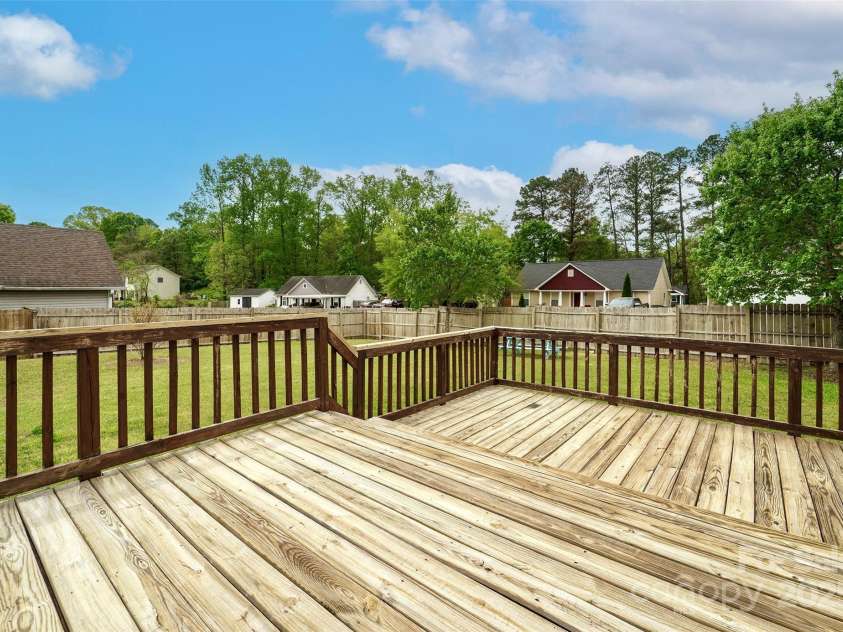 225 Carrie Court, Concord, NC 28027.  MLS# CAR4245716, YatesRealty ID 7444. Great Deck for entertaining