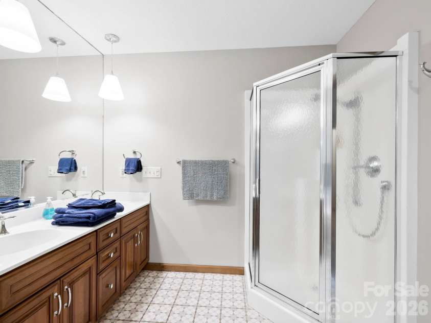 581 Hubbard Hollow Road, Rosman, NC 28772.  MLS# CAR4341055, YatesRealty ID 7449. Primary Shower and Double Vanity