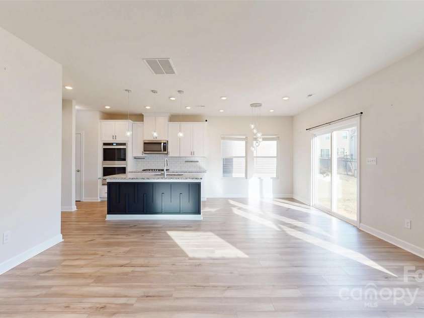 527 Palmarosa Street, Fort Mill, SC 29715.  MLS# CAR4320377, YatesRealty ID 745. View from Family Room towards the eat-in Kitchen