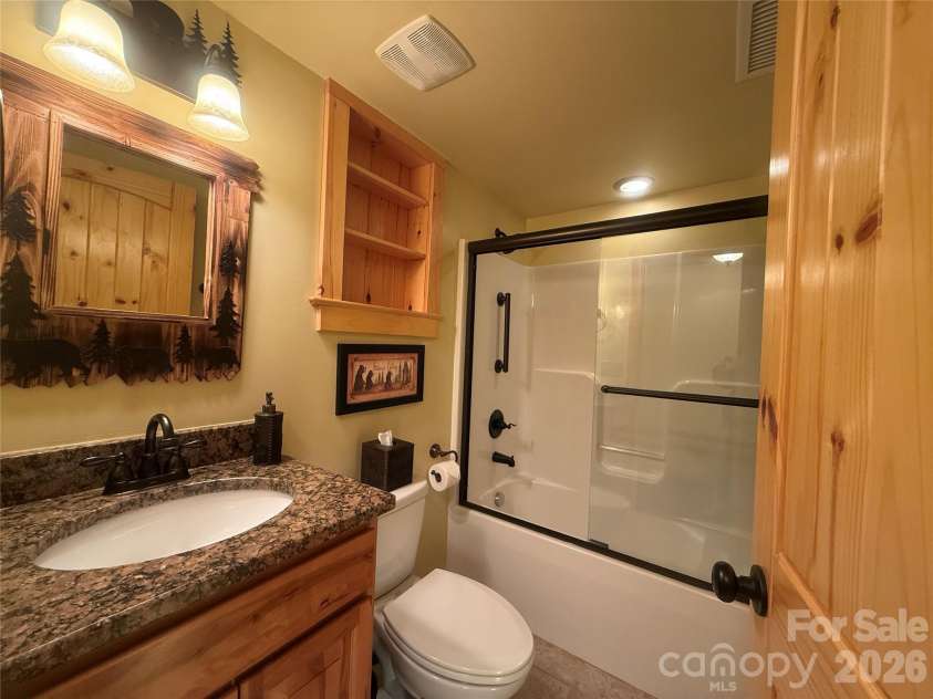 476 Double Eagle Drive, Nebo, NC 28761.  MLS# CAR4360435, YatesRealty ID 7450. Basement bath 