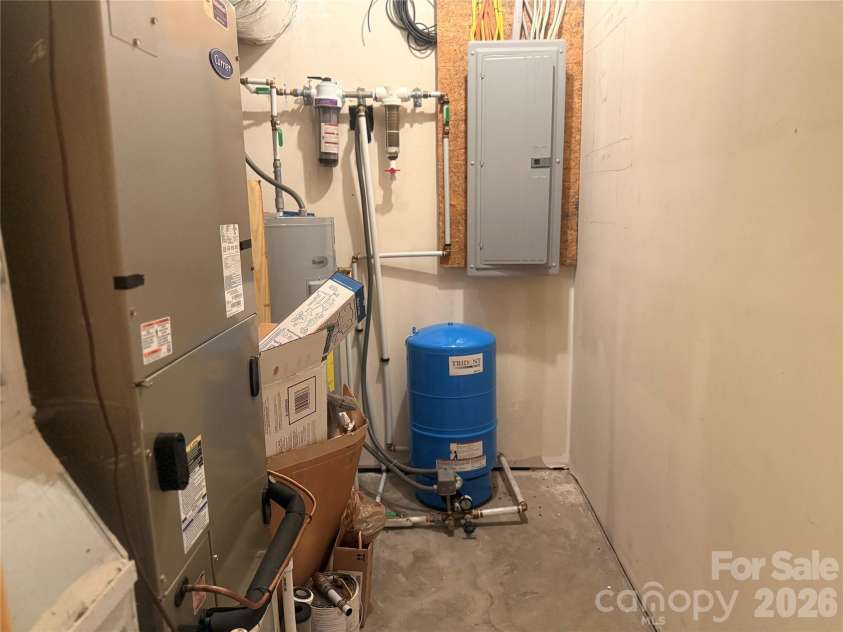 476 Double Eagle Drive, Nebo, NC 28761.  MLS# CAR4360435, YatesRealty ID 7450. Basement utility room