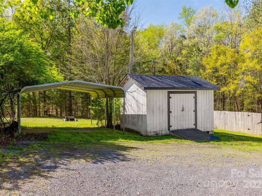 1849 Harris Road, Fort Mill, SC 29708.  MLS# CAR4241531, YatesRealty ID 7458. Carport and Shed (convey along with riding lawn mower)