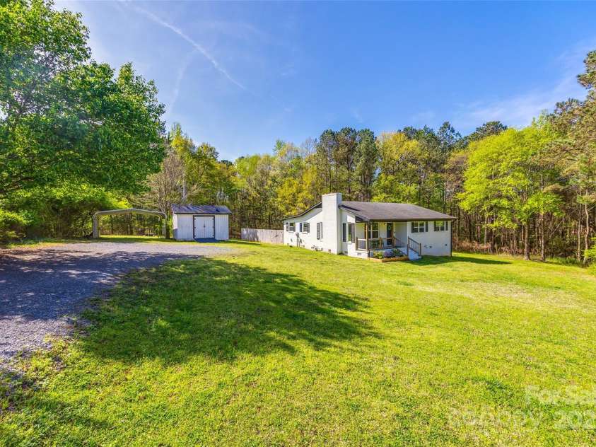 1849 Harris Road, Fort Mill, SC 29708.  MLS# CAR4241531, YatesRealty ID 7458. Gravel Driveway up to the home