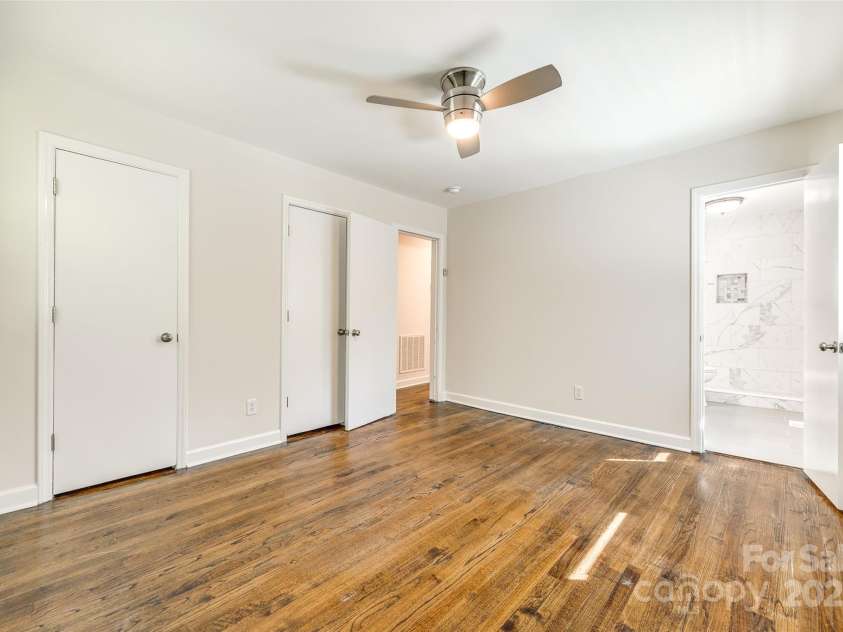 1849 Harris Road, Fort Mill, SC 29708.  MLS# CAR4241531, YatesRealty ID 7458. Primary bedroom with view into ensuite bathroom
