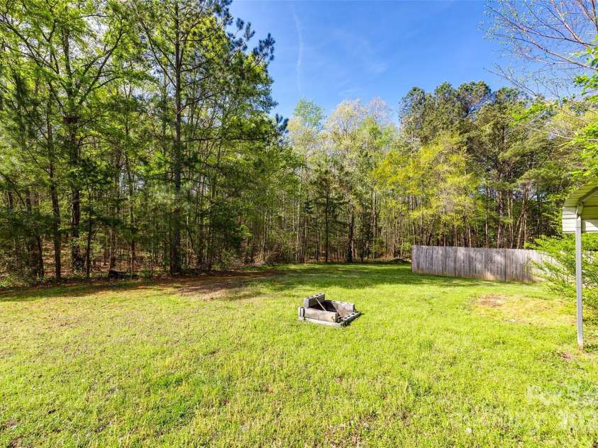 1849 Harris Road, Fort Mill, SC 29708.  MLS# CAR4241531, YatesRealty ID 7458. Side yard