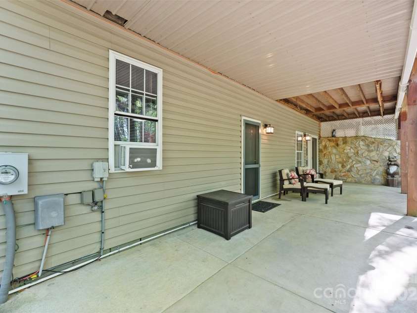 109 Wren Lane, Mooresville, NC 28117.  MLS# CAR4245335, YatesRealty ID 7464. Covered patio basement level