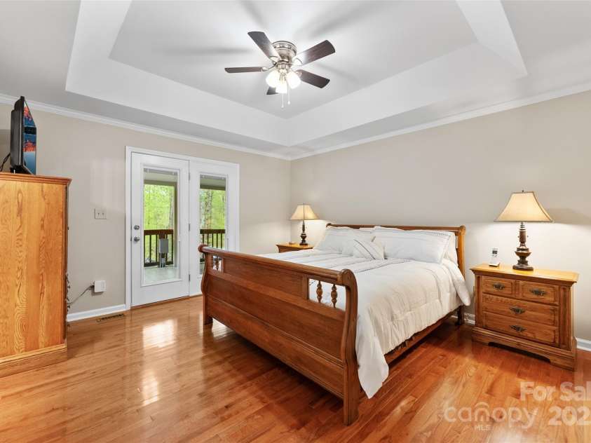 109 Wren Lane, Mooresville, NC 28117.  MLS# CAR4245335, YatesRealty ID 7464. Master leading to covered deck