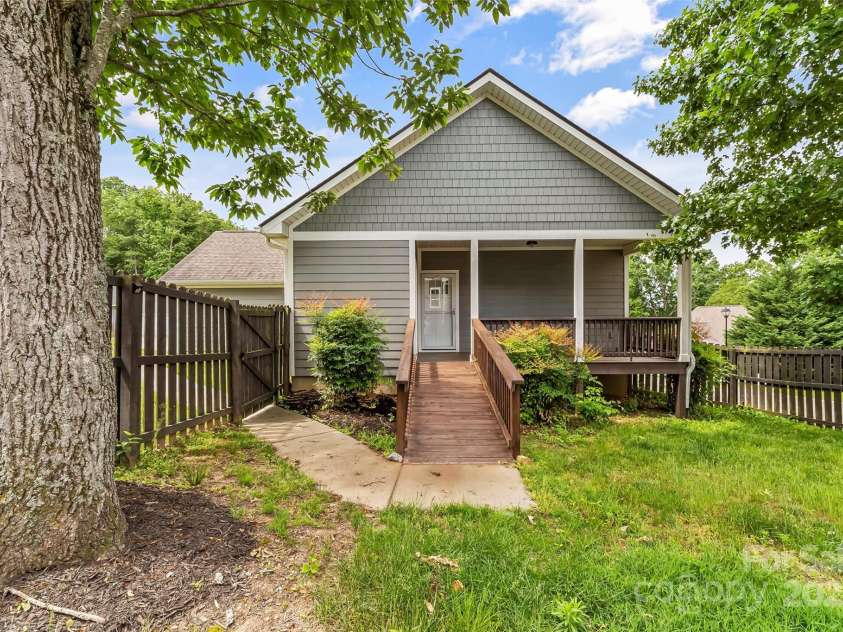 6 Meeting Street, Asheville, NC 28803.  MLS# CAR4266058, YatesRealty ID 7465. Paved sidewalk to ramp entrance