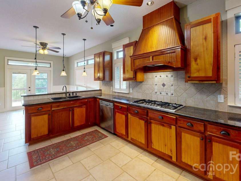 6 Sunrise Valley, Leicester, NC 28748.  MLS# CAR4283211, YatesRealty ID 7475. Kitchen looking into dining area