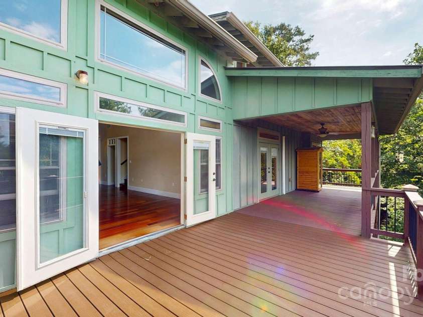 6 Sunrise Valley, Leicester, NC 28748.  MLS# CAR4283211, YatesRealty ID 7475. Looking into Living Room on large deck