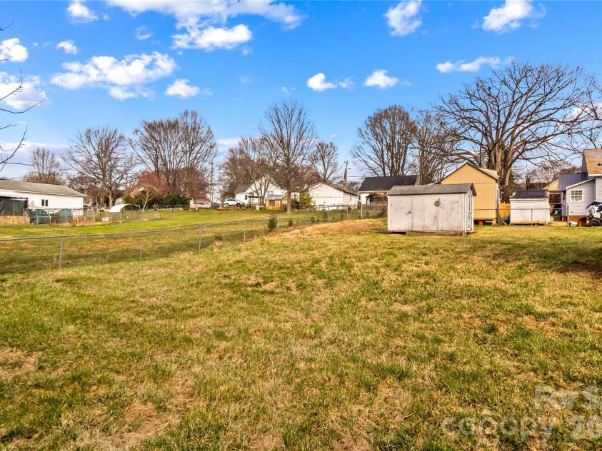 126 Thomas Street, Troutman, NC 28166.  MLS# CAR4355493, YatesRealty ID 7478. Back Yard