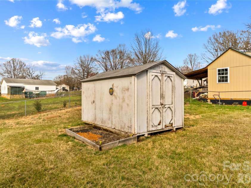 126 Thomas Street, Troutman, NC 28166.  MLS# CAR4355493, YatesRealty ID 7478. Storage Building