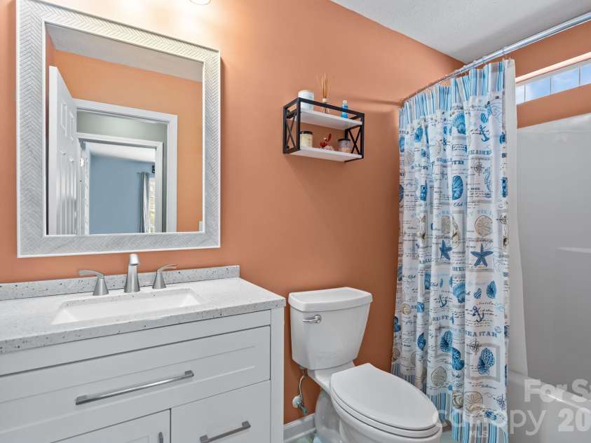 137 4th Street, Oak Island, NC 28465.  MLS# CAR4363767, YatesRealty ID 7502. 2nd full bath