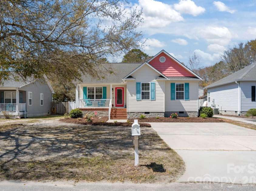 137 4th Street, Oak Island, NC 28465.  MLS# CAR4363767, YatesRealty ID 7502. Long driveway fits 4 vehicles