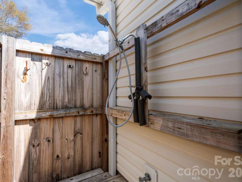 137 4th Street, Oak Island, NC 28465.  MLS# CAR4363767, YatesRealty ID 7502. Outdoor shower