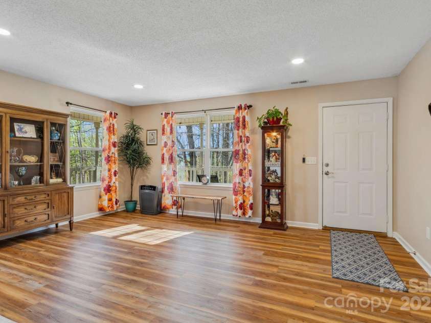 12 Hutchinson Woods Drive, Fletcher, NC 28732.  MLS# CAR4238385, YatesRealty ID 752. This living space has room to spare.