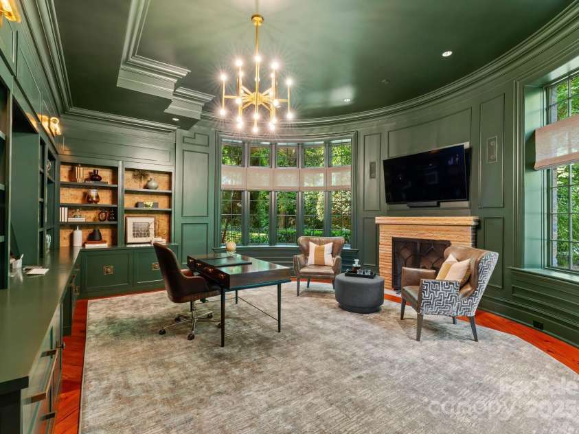 4536 Fox Brook Lane, Charlotte, NC 28211.  MLS# CAR4157549, YatesRealty ID 7532. Executive Office with fireplace, sitting area with custom CR Laine furniture, 90” windows with 180 degree view of pond & terrace. Oversized closet and file storage system.