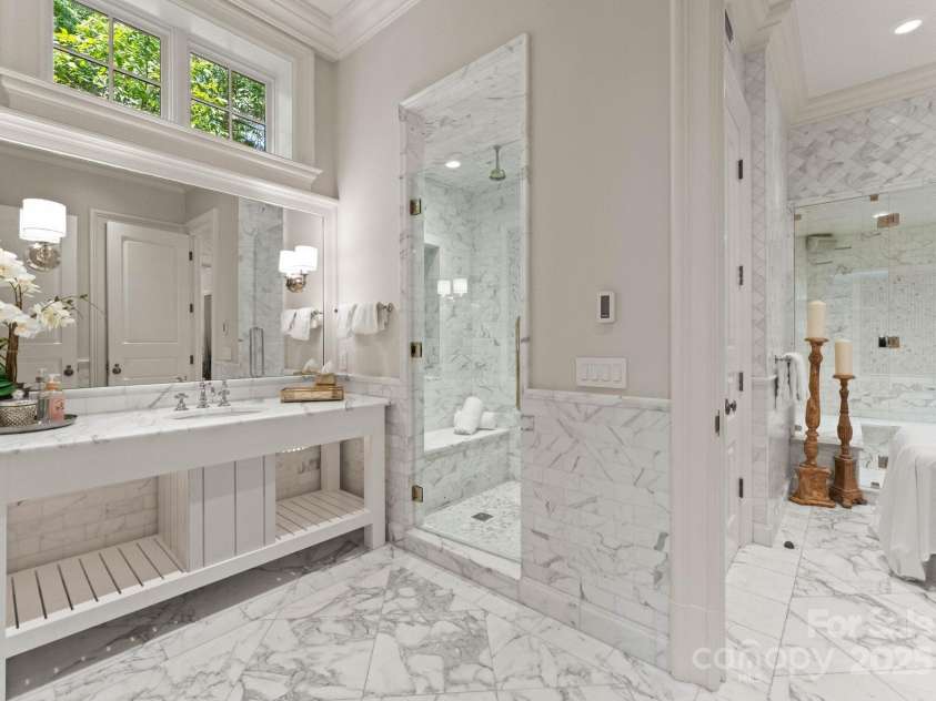 4536 Fox Brook Lane, Charlotte, NC 28211.  MLS# CAR4157549, YatesRealty ID 7532. Full bathroom with rain head shower, and marble floors.