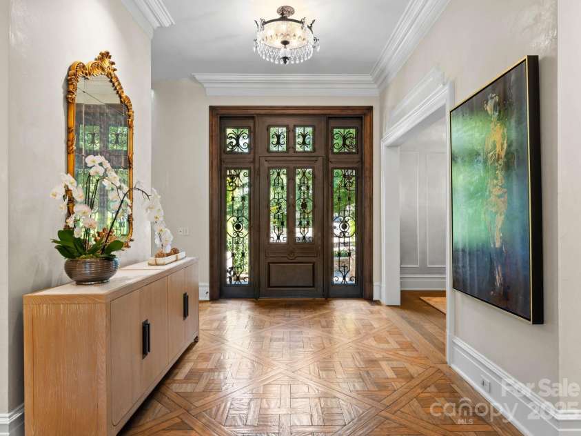 4536 Fox Brook Lane, Charlotte, NC 28211.  MLS# CAR4157549, YatesRealty ID 7532. Grand entrance with custom hand-hewn Versailles parquet floors.