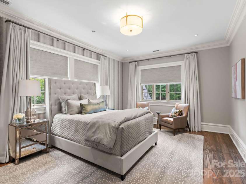 4536 Fox Brook Lane, Charlotte, NC 28211.  MLS# CAR4157549, YatesRealty ID 7532. Secondary bedroom with  hardwood floors and custom cut area rug and window treatments.