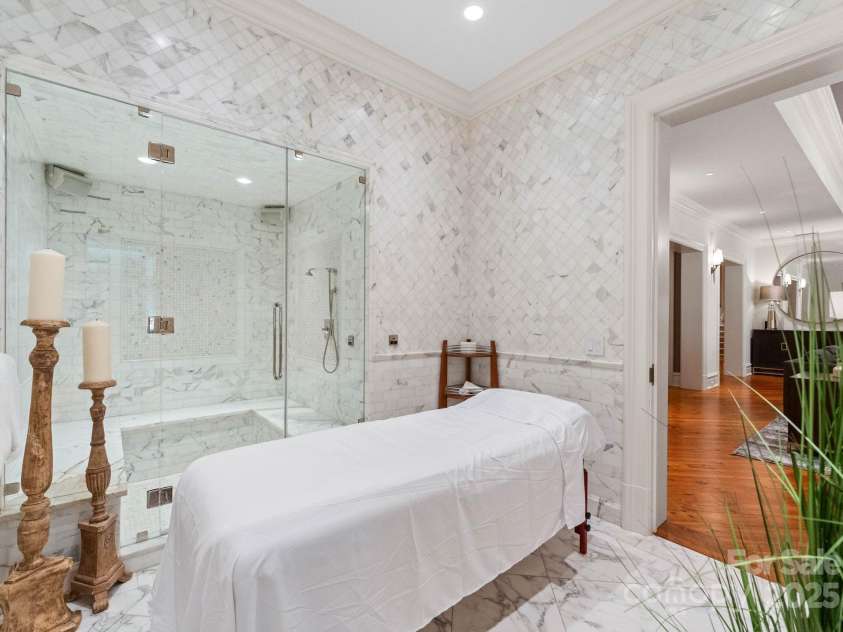4536 Fox Brook Lane, Charlotte, NC 28211.  MLS# CAR4157549, YatesRealty ID 7532. Spa with 6 person steam shower. Floor to ceiling marble tile.