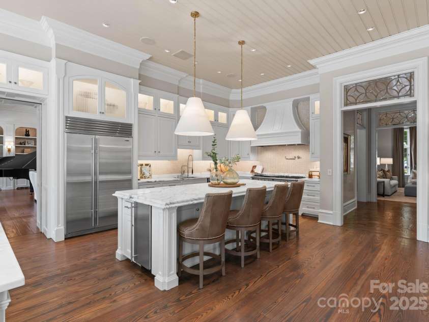 4536 Fox Brook Lane, Charlotte, NC 28211.  MLS# CAR4157549, YatesRealty ID 7532. Two farm style sinks with Calacatta Gold Marble countertopsBuilt-in Subzero refrigerator, separate SS ice maker, dual SS dishwashers.