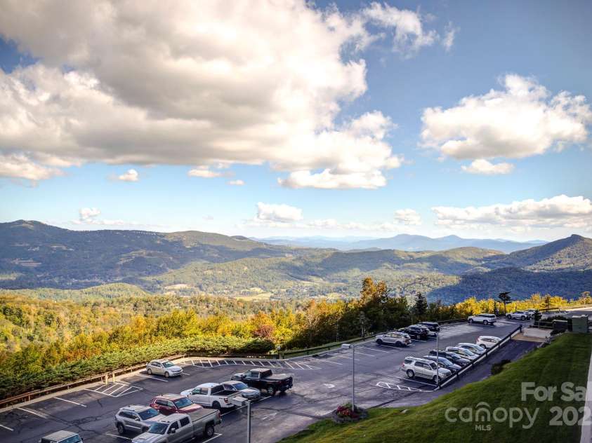 303 Sugar Top Drive, Sugar Mountain, NC 28604.  MLS# CAR4302428, YatesRealty ID 7533. Look to the Right, Long Range Layered Views