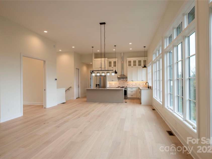 15 Evian Court, Asheville, NC 28804.  MLS# CAR4320178, YatesRealty ID 754. Great Room and Kitchen