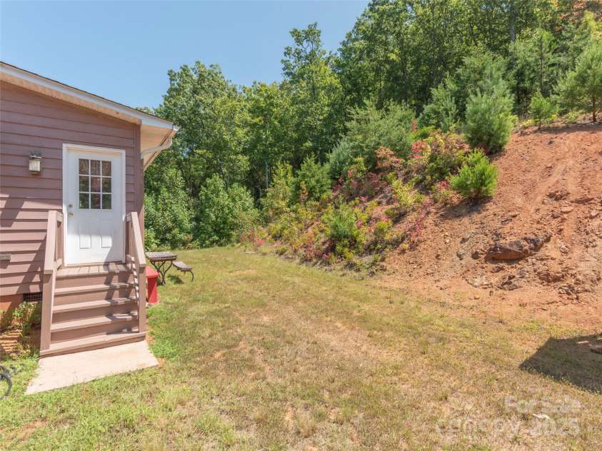 1120 Jacobs Branch Road, Franklin, NC 28734.  MLS# CAR4176894, YatesRealty ID 7545. Backyard main level entry