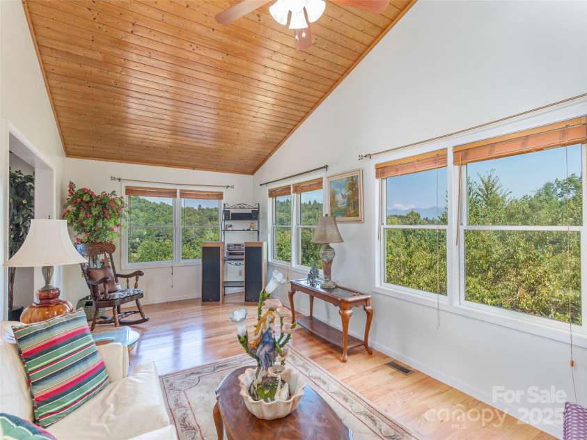 1120 Jacobs Branch Road, Franklin, NC 28734.  MLS# CAR4176894, YatesRealty ID 7545. Sunroom fills with morning light