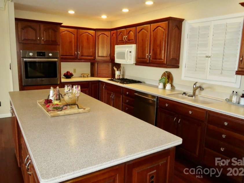 871 Glen Cannon Drive, Pisgah Forest, NC 28768.  MLS# CAR4216993, YatesRealty ID 7558. Corian countertops and double sink