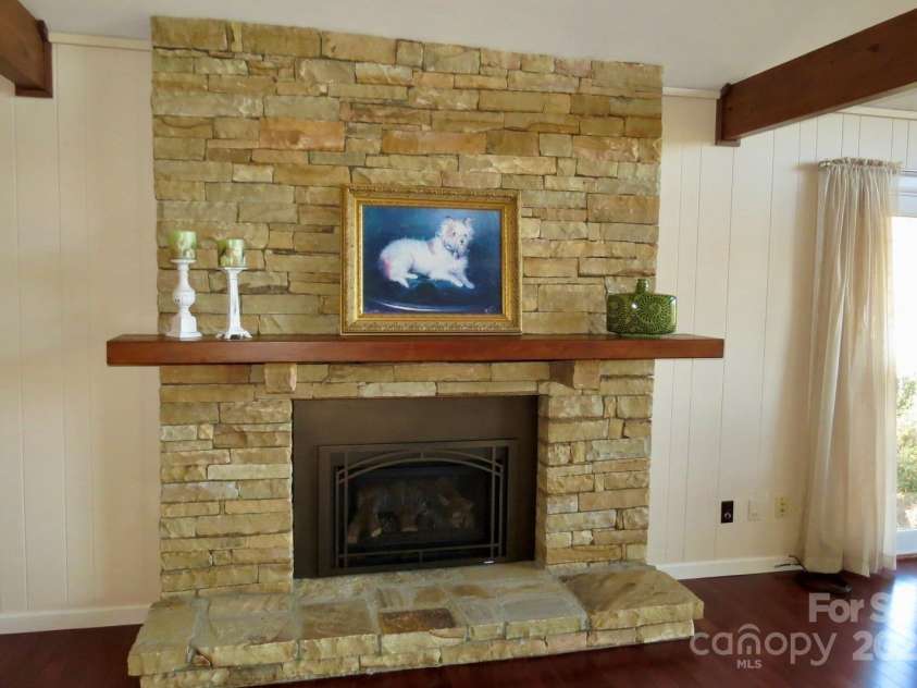 871 Glen Cannon Drive, Pisgah Forest, NC 28768.  MLS# CAR4216993, YatesRealty ID 7558. Gas stone fireplace in great room