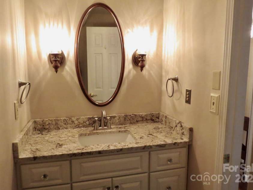 871 Glen Cannon Drive, Pisgah Forest, NC 28768.  MLS# CAR4216993, YatesRealty ID 7558. Powder Room on main level