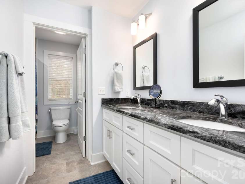 31 Central Avenue, Asheville, NC 28806.  MLS# CAR4355209, YatesRealty ID 7563. Dual Vanity in Guest Bath