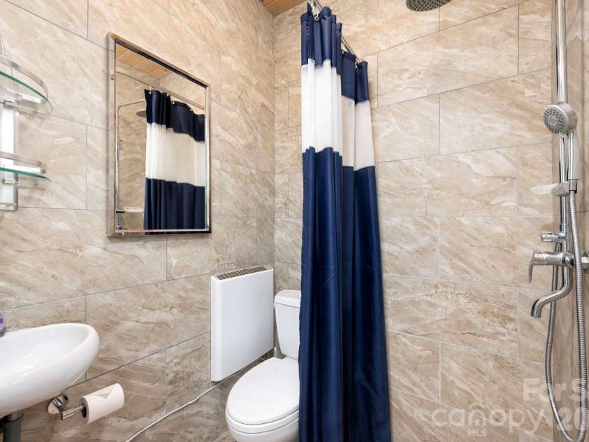 31 Central Avenue, Asheville, NC 28806.  MLS# CAR4355209, YatesRealty ID 7563. Lower level full bathroom