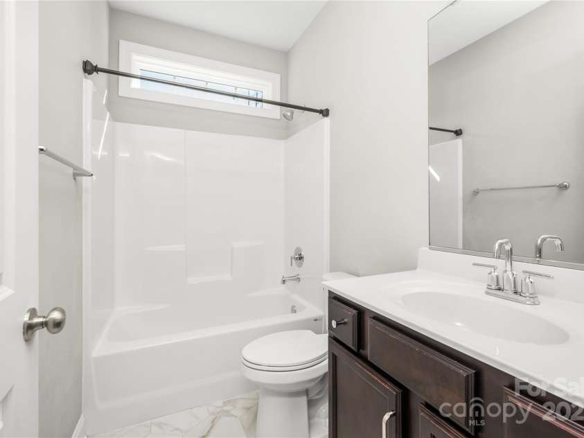 169 Turnberry Drive, Mocksville, NC 27028.  MLS# CAR4239304, YatesRealty ID 7567. Guest Bathroom