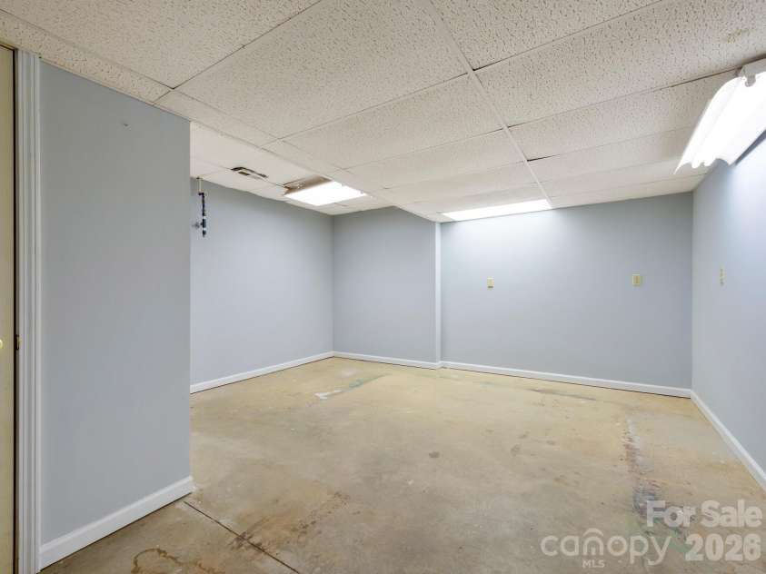 17 Ashton Forest Court, Hendersonville, NC 28739.  MLS# CAR4352312, YatesRealty ID 7571. Lower Level Workshop/ Storage Room with Utilites