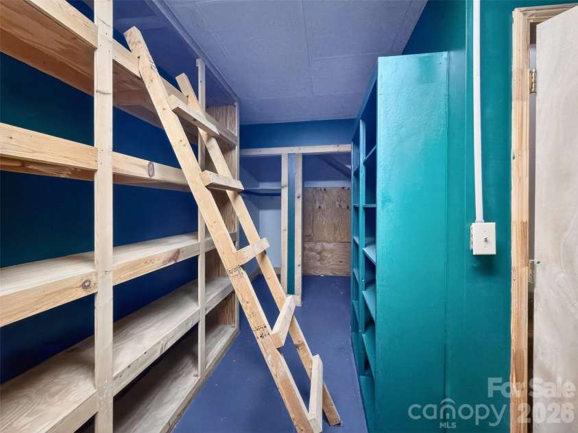 345 Lower Switchback Road, Union Mills, NC 28167.  MLS# CAR4356229, YatesRealty ID 7582. Basement Storage Behind Stairs