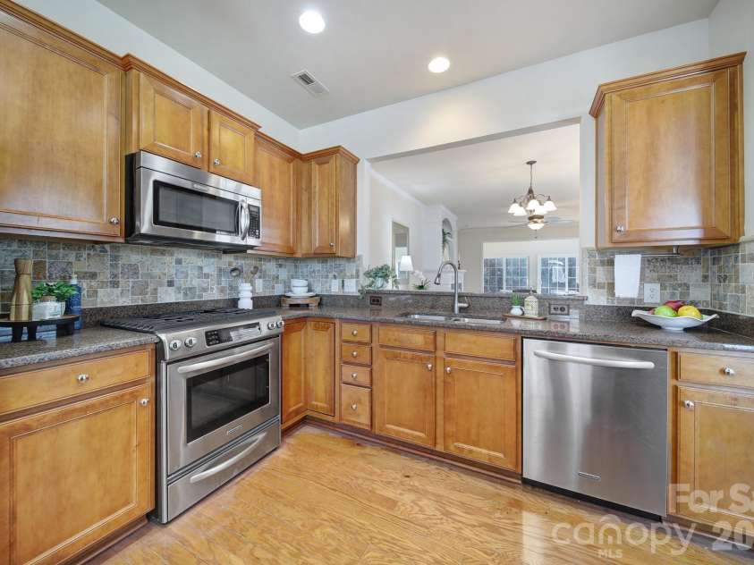 1488 River Bend Boulevard, Fort Mill, SC 29707.  MLS# CAR4329801, YatesRealty ID 7583. Another view of the kitchen with a lazy susan corner cabinet:)